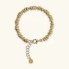 Bracciale con Rondelle Martellate e Sfere Lucide